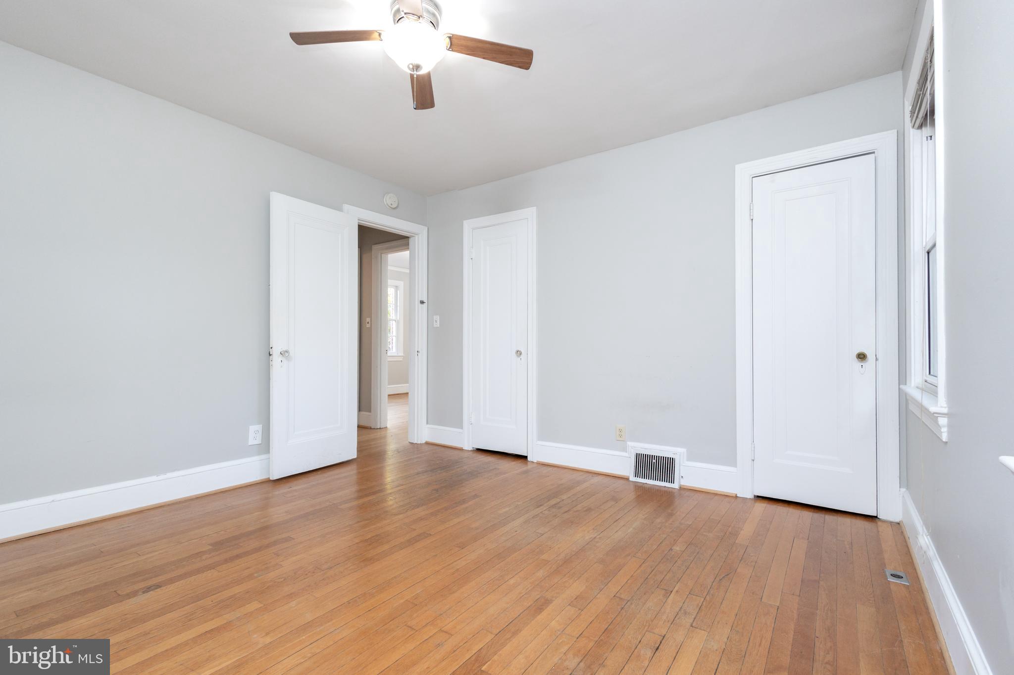 312 North Highland Street Arlington, VA 22201 - Photo 18 of 33 a view of an empty room with wooden floor