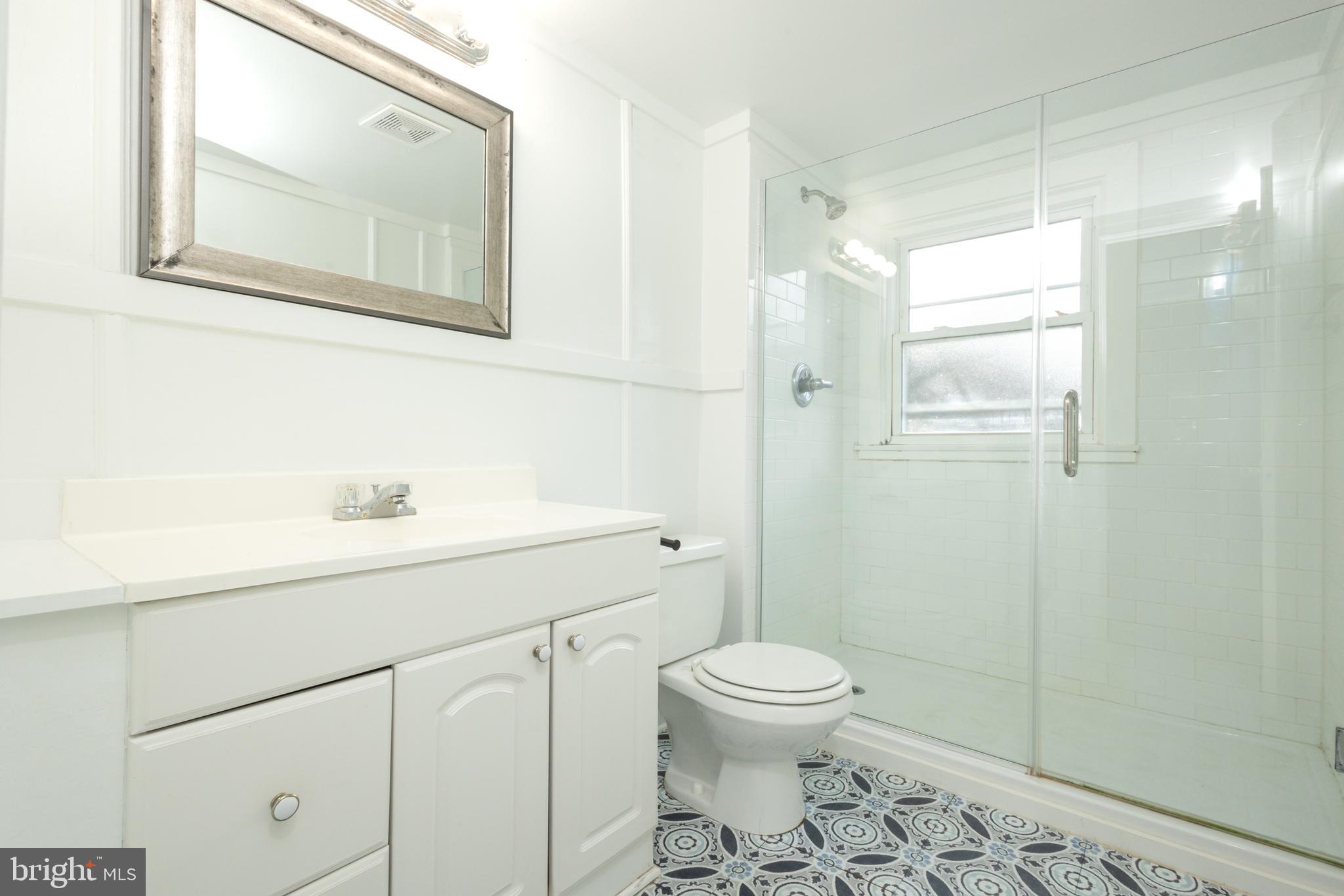 312 North Highland Street Arlington, VA 22201 - Photo 20 of 33 a bathroom with a sink a toilet and shower