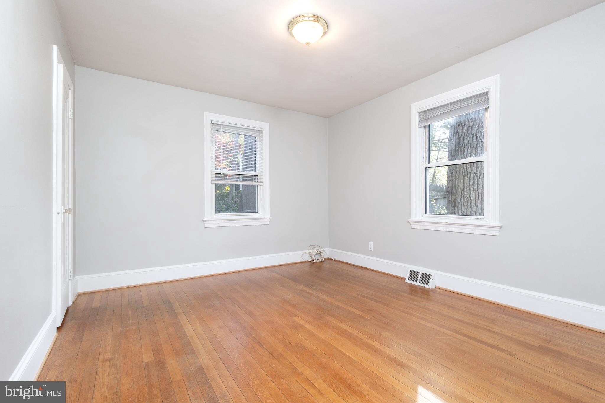 312 North Highland Street Arlington, VA 22201 - Photo 23 of 33 a view of an empty room with wooden floor and a window