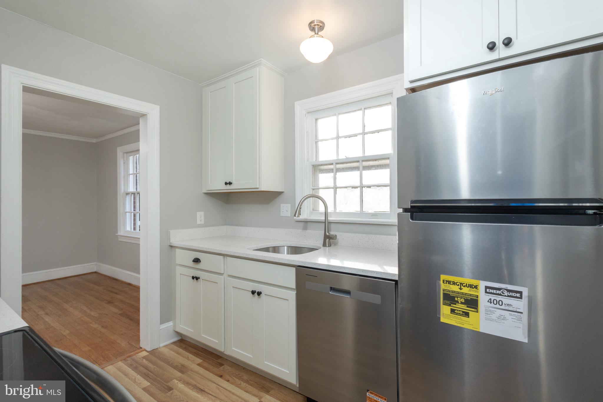 312 North Highland Street Arlington, VA 22201 - Photo 6 of 33 a kitchen with a refrigerator and a sink