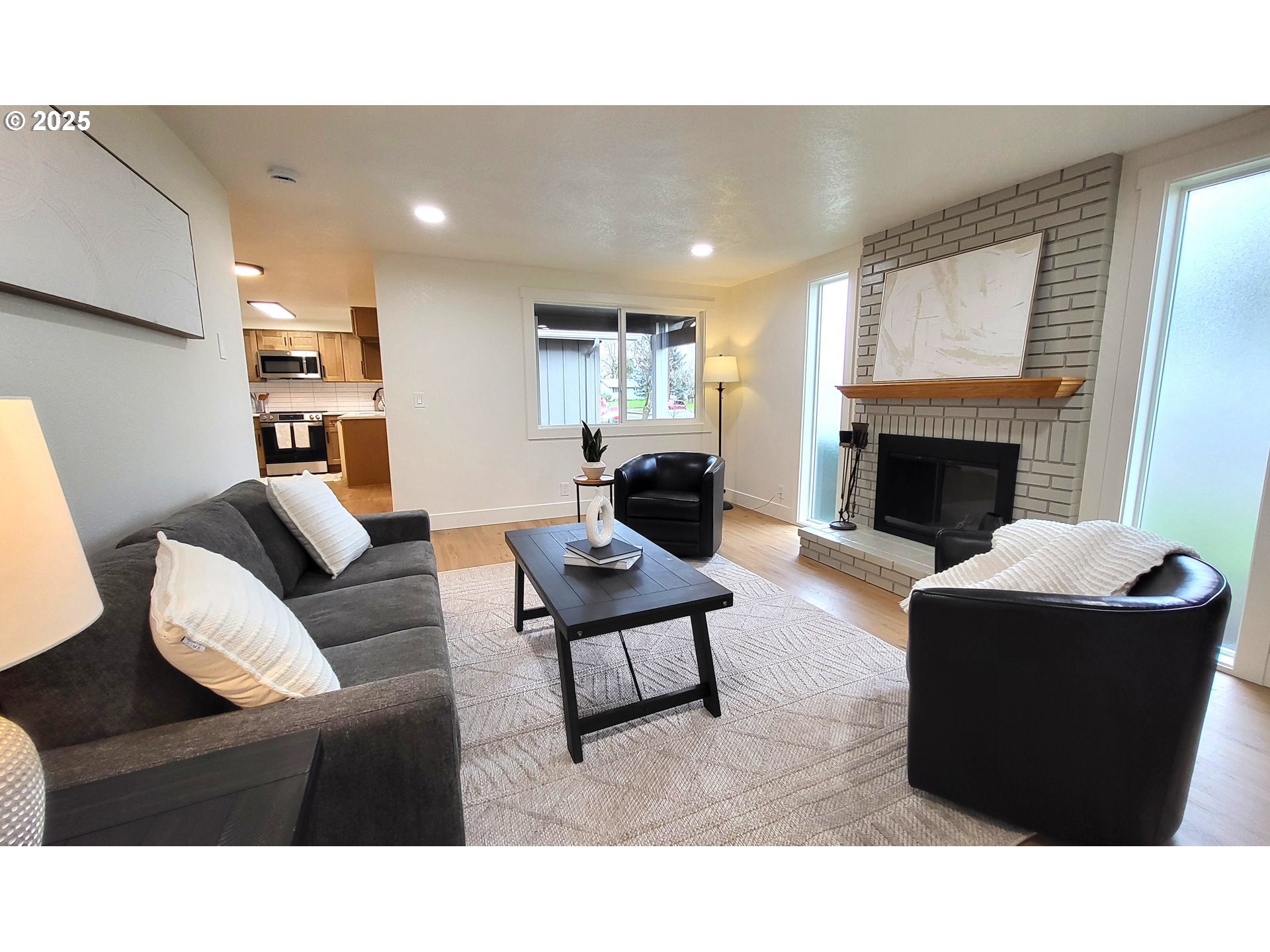 2240 Providence Street Eugene, OR 97401 - Photo 15 of 28 a living room with furniture and a fireplace