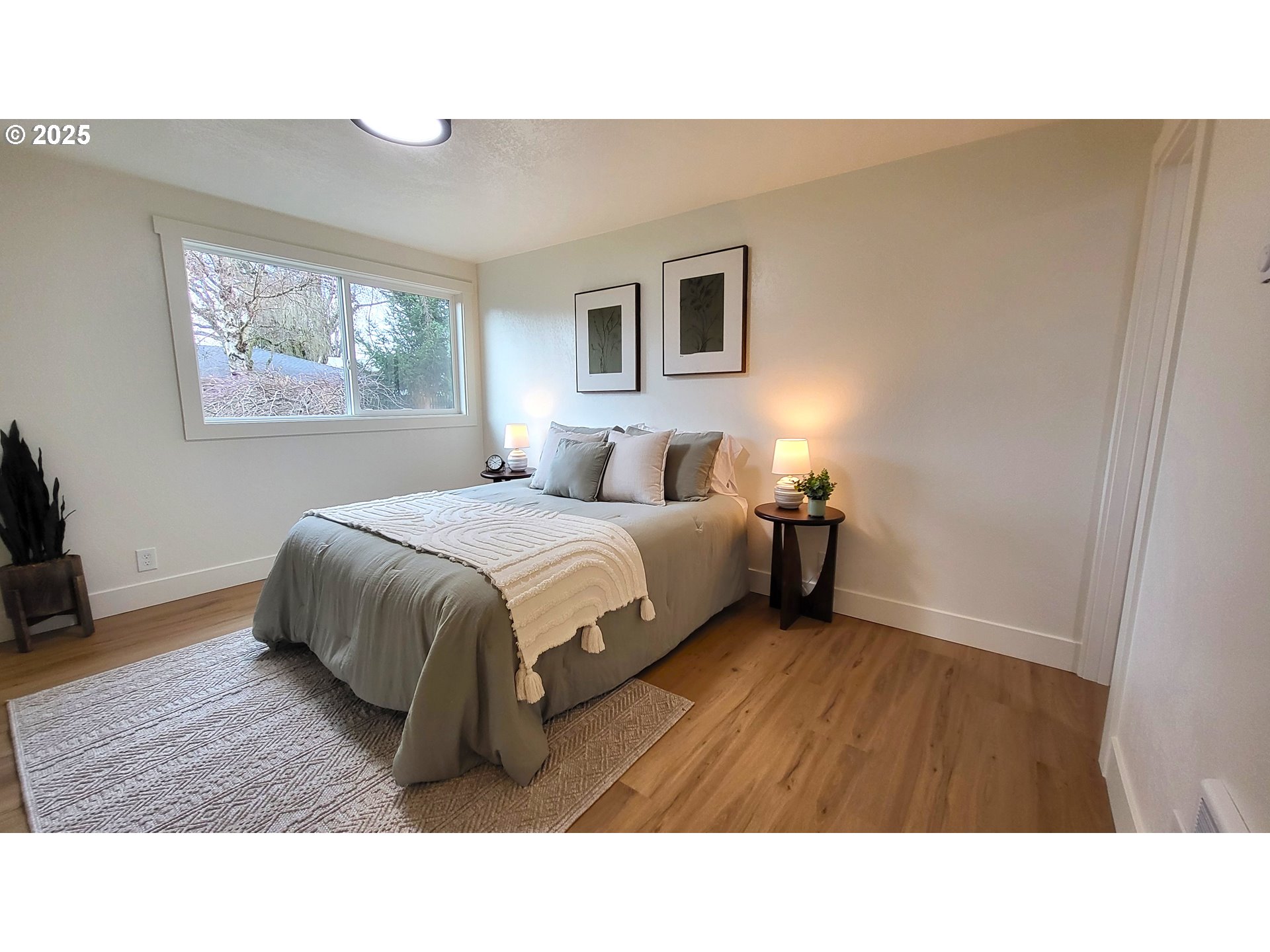 2240 Providence Street Eugene, OR 97401 - Photo 16 of 28 a living room with a bed furniture and a window