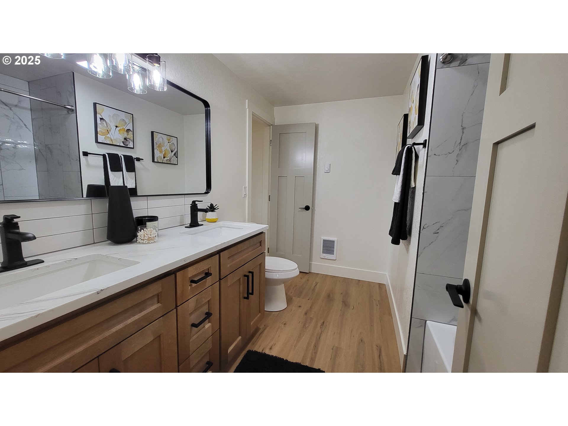 2240 Providence Street Eugene, OR 97401 - Photo 18 of 28 a bathroom with a sink a toilet a shower a mirror and vanity