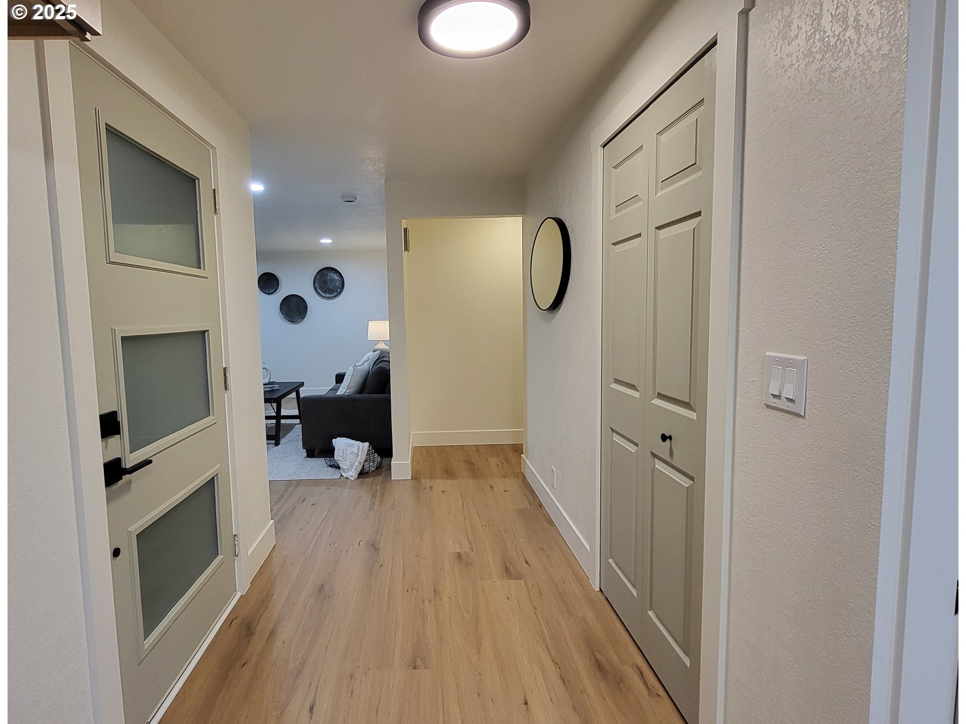 2240 Providence Street Eugene, OR 97401 - Photo 3 of 28 a view of a hallway with wooden floor and staircase