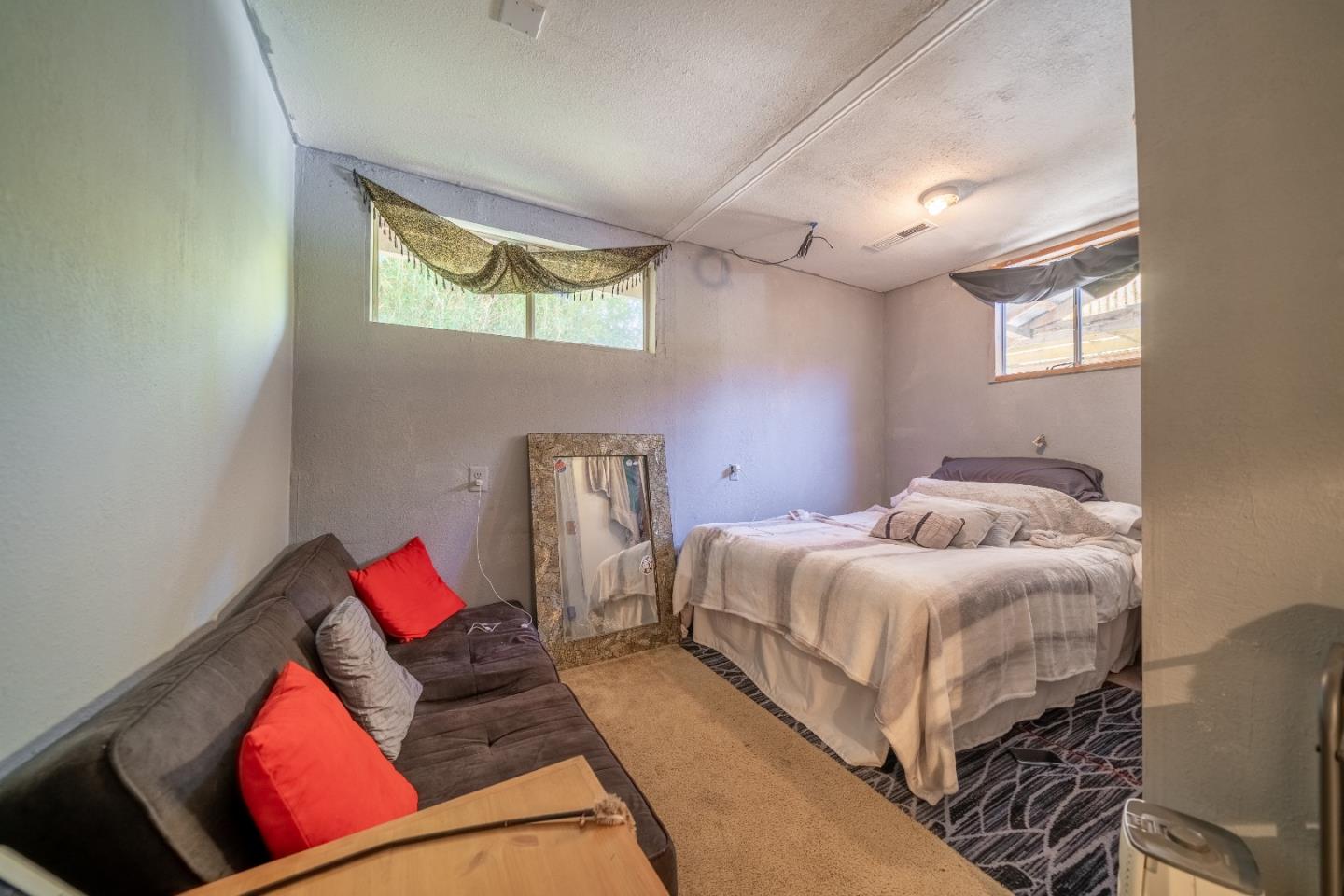 41 Varni Road Watsonville, CA 95076 - Photo 45 of 59 a bedroom with a bed and wooden floor