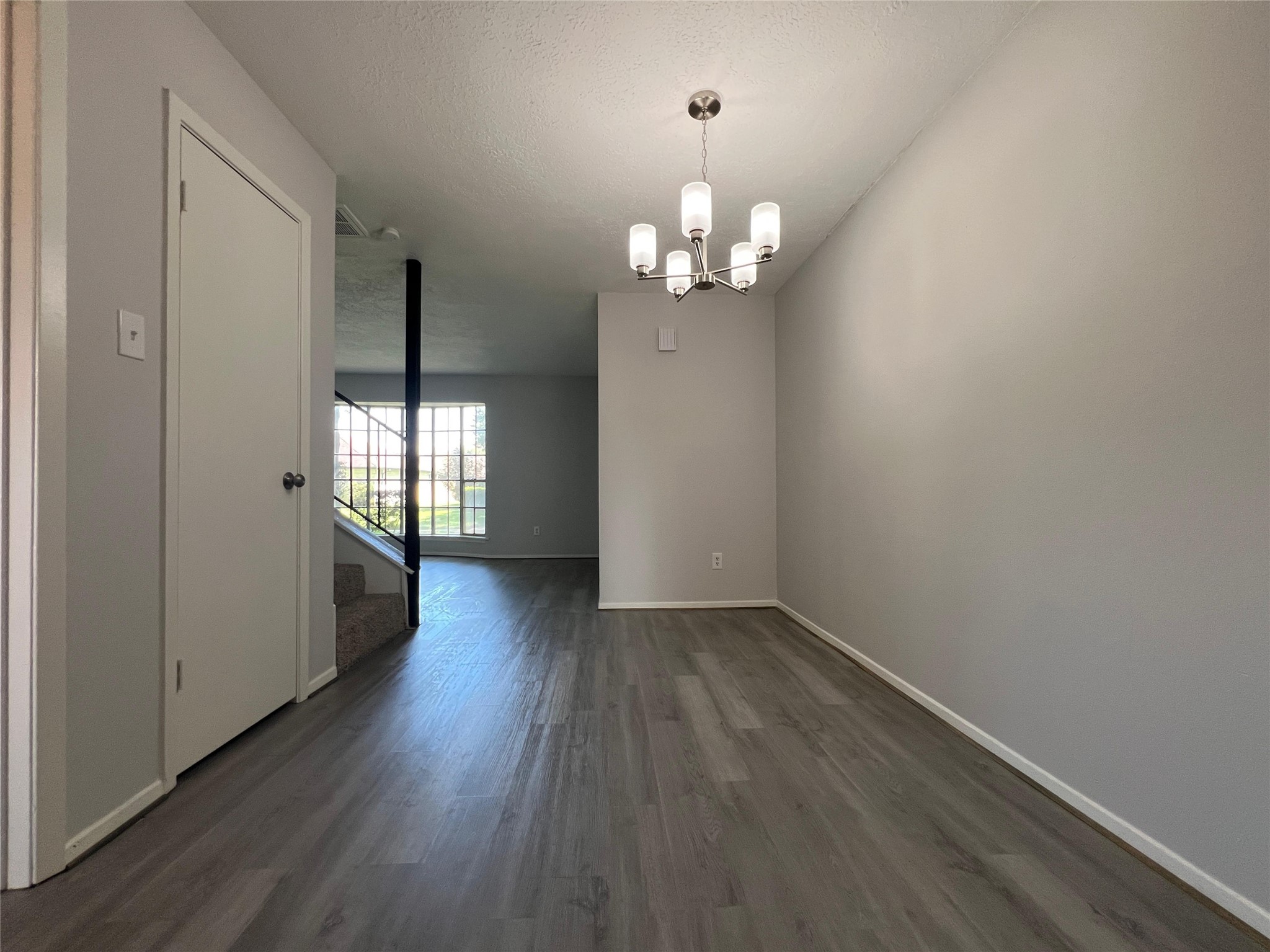 7012 Jetty Lane Houston, TX 77072 - Photo 5 of 24 wooden floor in an empty room with a window