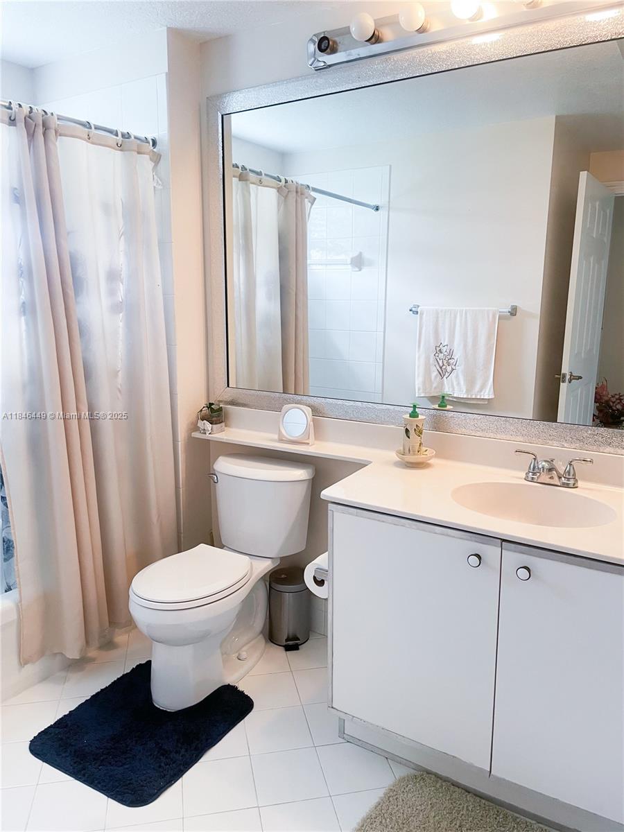 7635 Southampton Terrace, Unit 201 Tamarac, FL 33321 - Photo 11 of 23 a bathroom with a sink toilet and shower