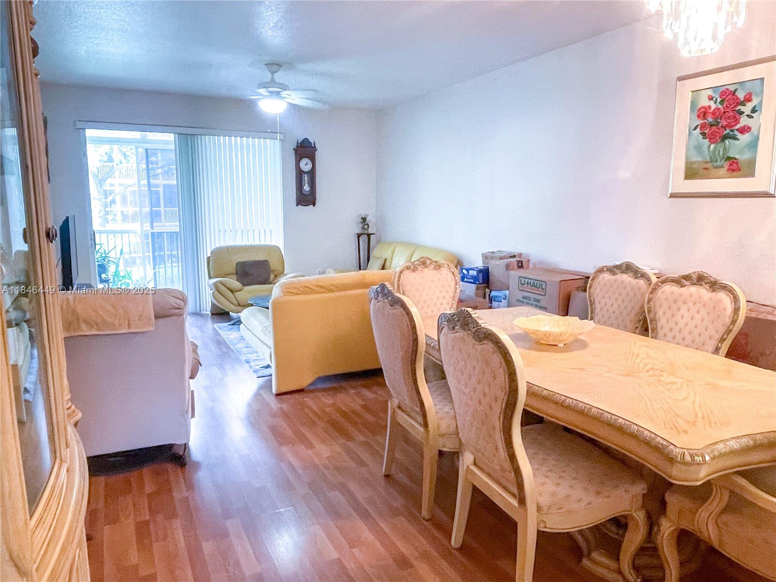 7635 Southampton Terrace, Unit 201 Tamarac, FL 33321 - Photo 13 of 23 a living room with furniture and wooden floor