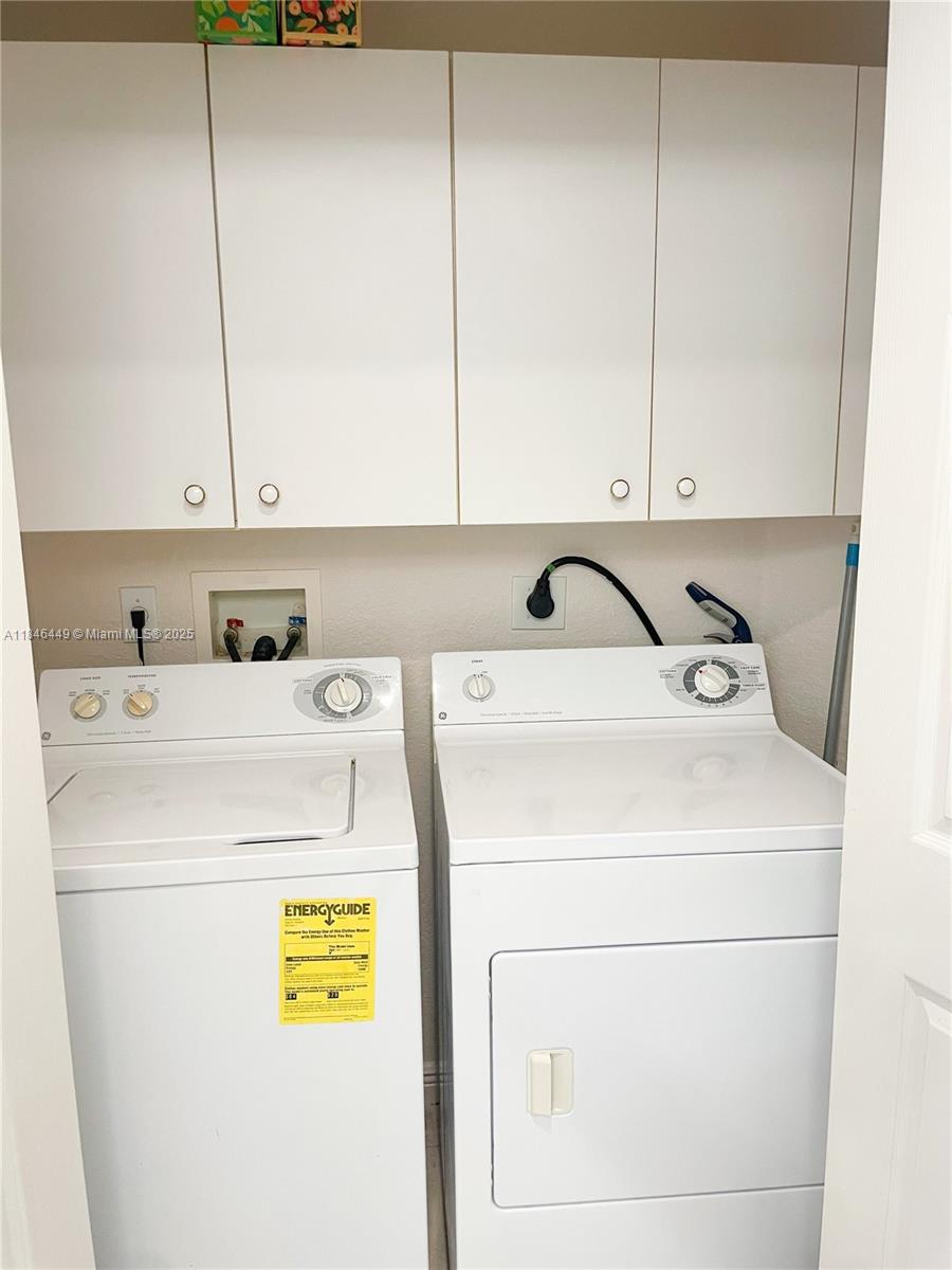 7635 Southampton Terrace, Unit 201 Tamarac, FL 33321 - Photo 15 of 23 a utility room with dryer and washer