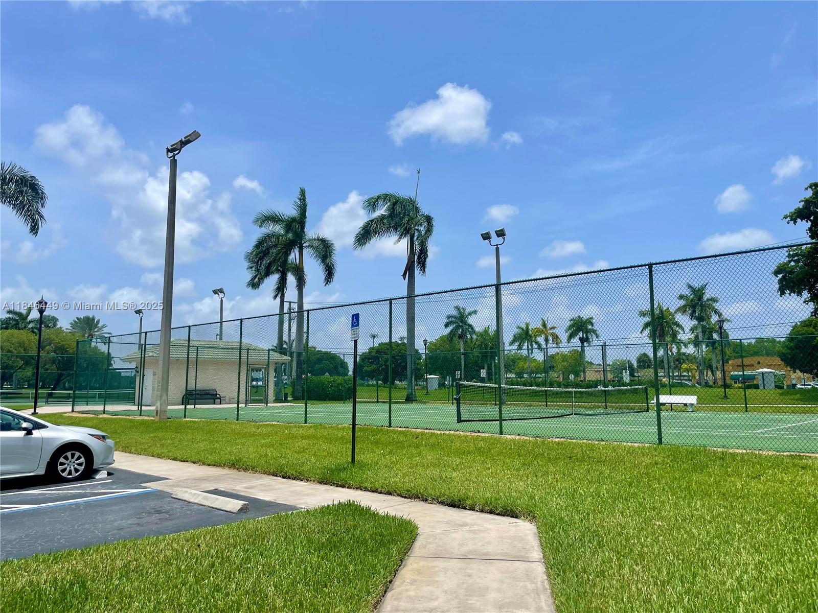 7635 Southampton Terrace, Unit 201 Tamarac, FL 33321 - Photo 18 of 23 a view of a park with swings