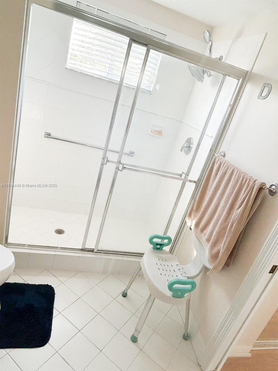 7635 Southampton Terrace, Unit 201 Tamarac, FL 33321 - Photo 7 of 23 a close up of a white chair with wooden floor