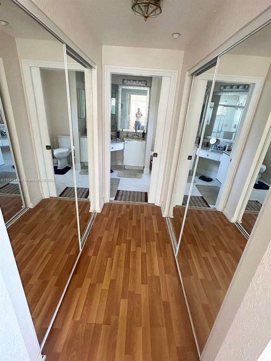 7635 Southampton Terrace, Unit 201 Tamarac, FL 33321 - Photo 8 of 23 a bed sitting in a room next to a window