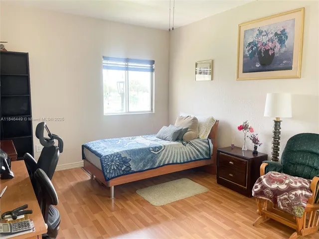 a living room with furniture rug and window