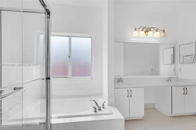 a bathroom with a bathtub and a sink