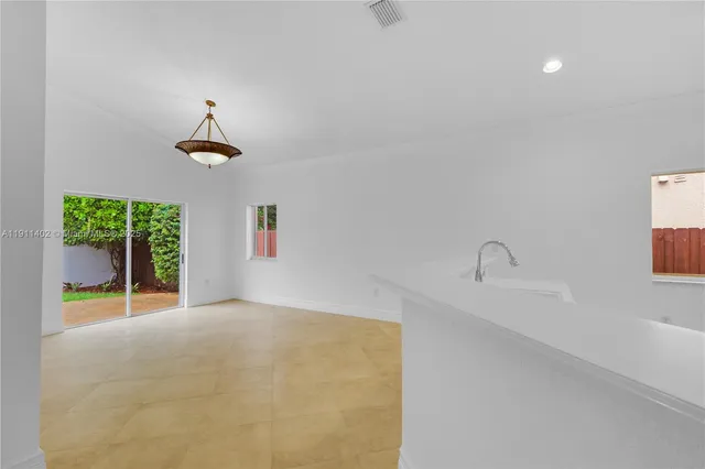 a view of a room with a sink and a window