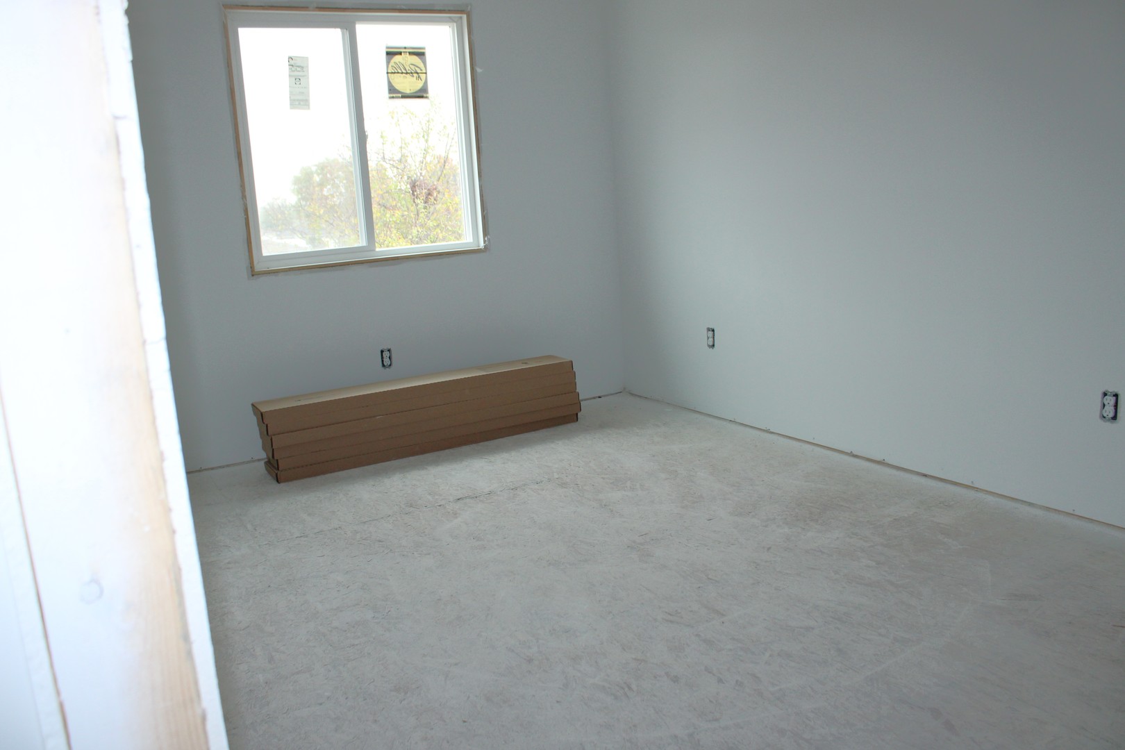 105 East Division Street, Unit 105 Manteno, IL 60950 - Photo 5 of 9 an empty room with window