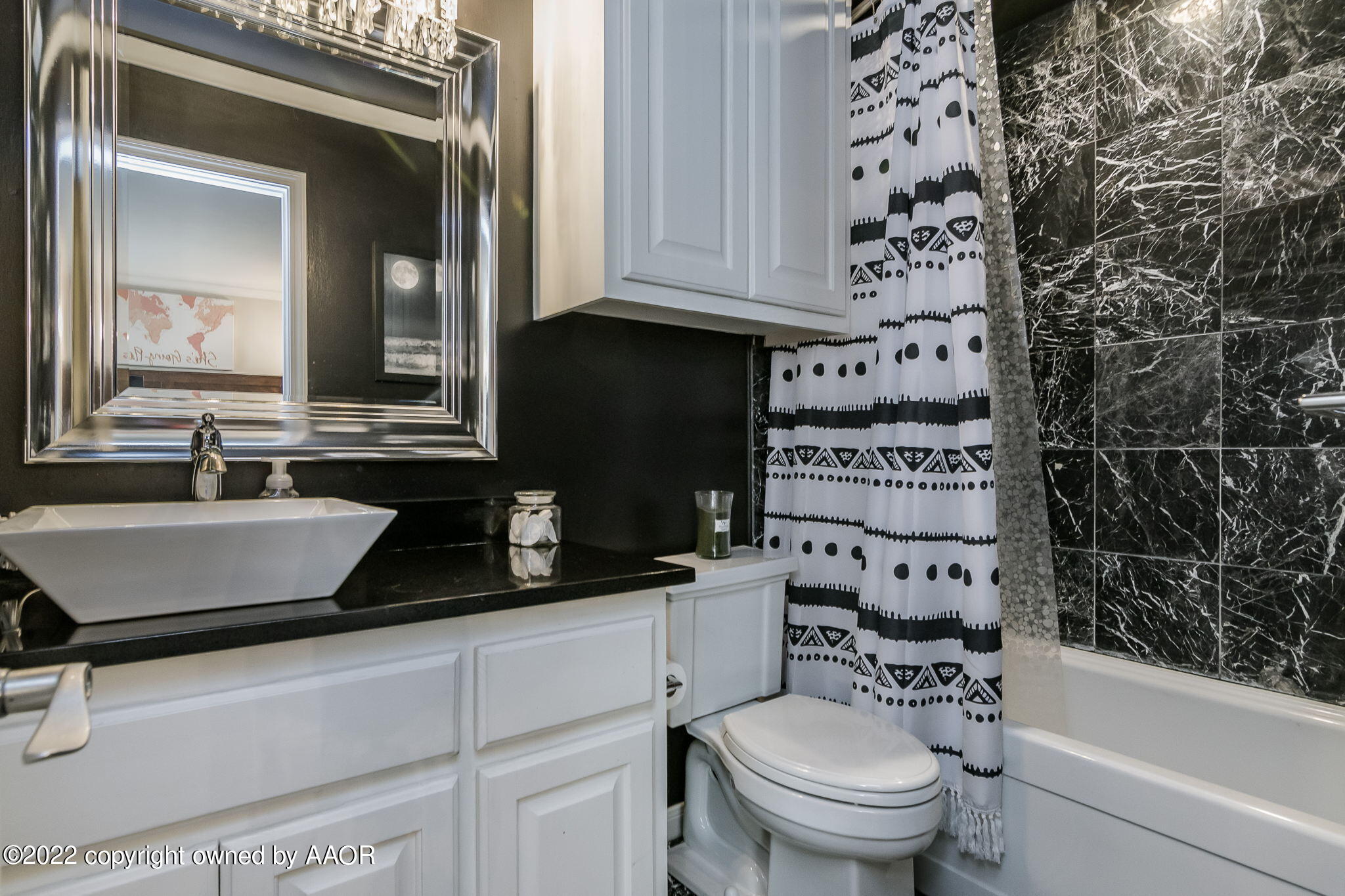 8101 Leah Trail Amarillo, TX 79110 - Photo 11 of 18 a bathroom with a sink a toilet and a mirror