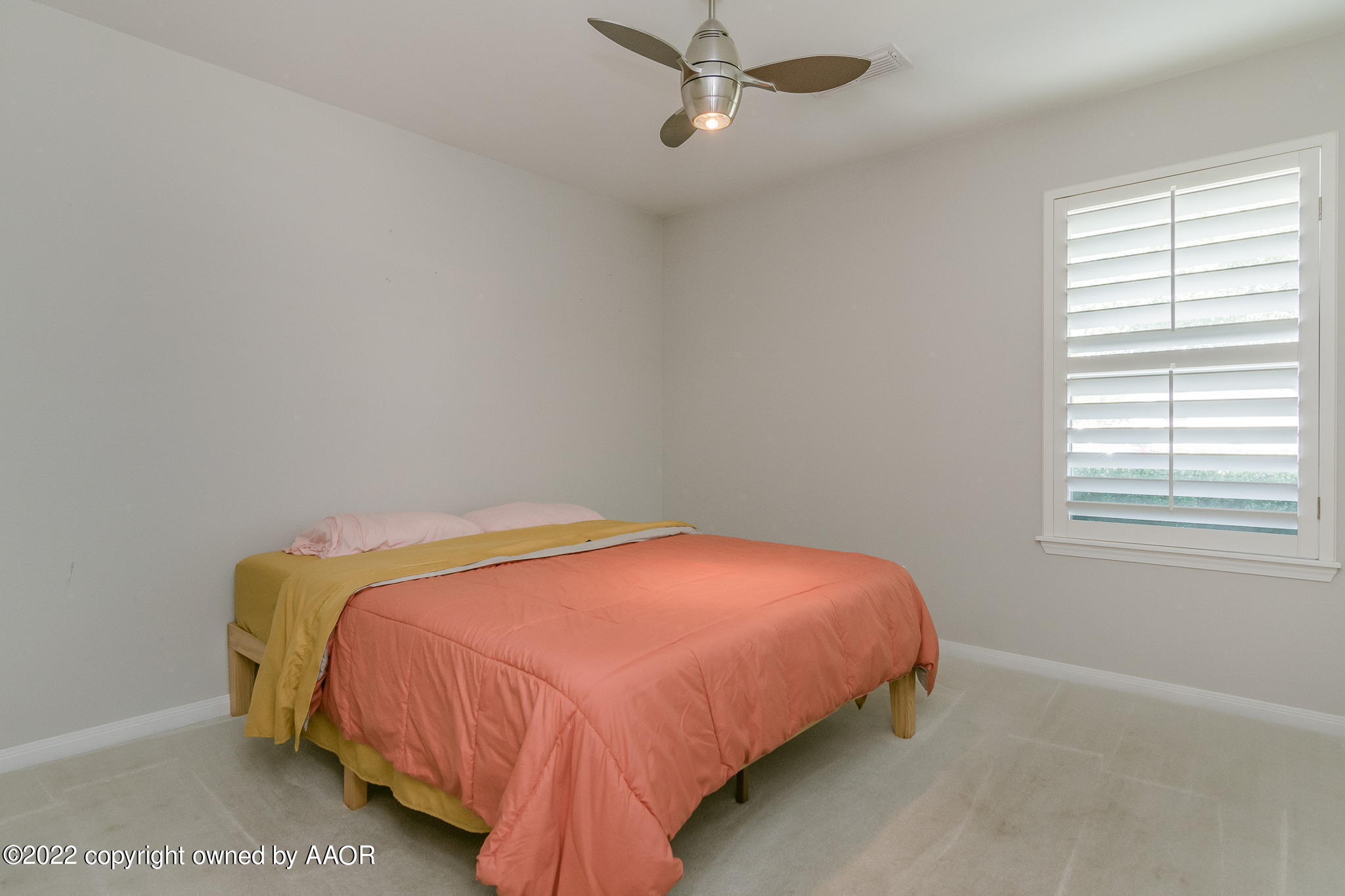 8101 Leah Trail Amarillo, TX 79110 - Photo 12 of 18 a bedroom with a bed and window
