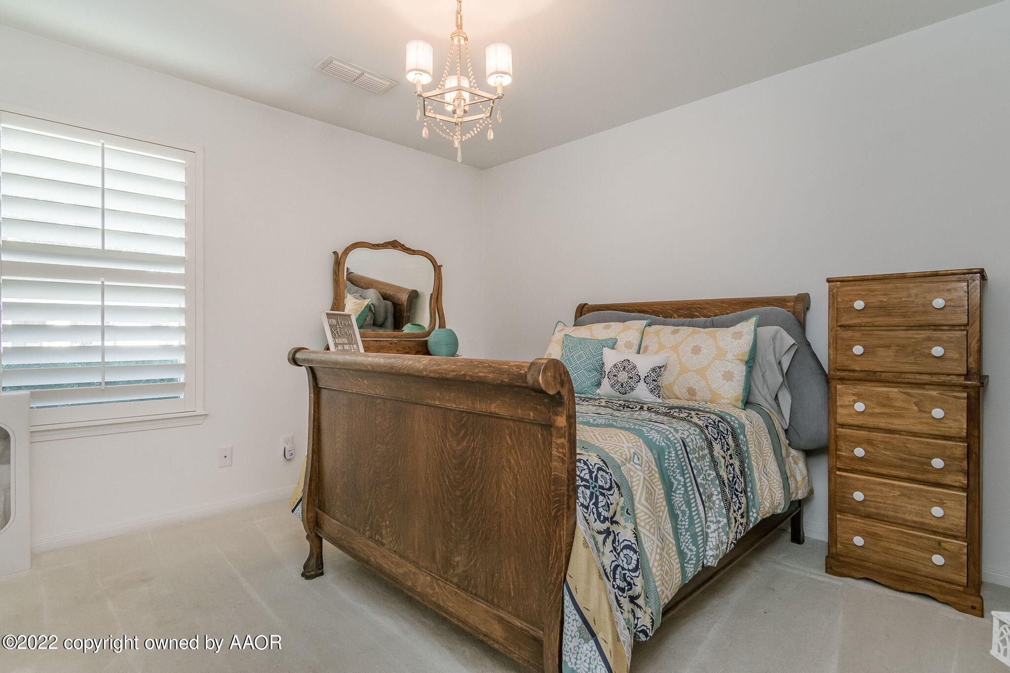 8101 Leah Trail Amarillo, TX 79110 - Photo 13 of 18 a bedroom with a bed and a window