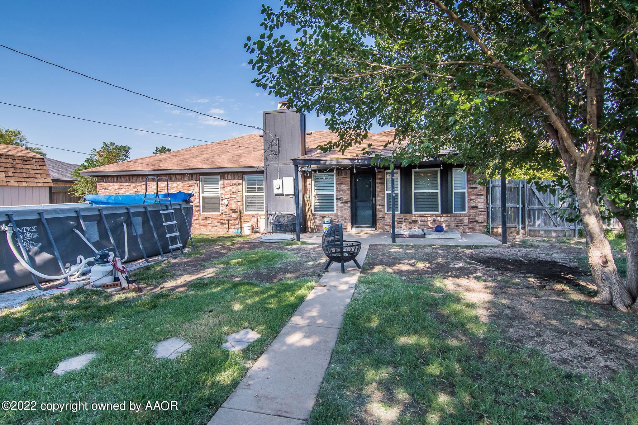 8101 Leah Trail Amarillo, TX 79110 - Photo 14 of 18 a front view of a house with garden and patio