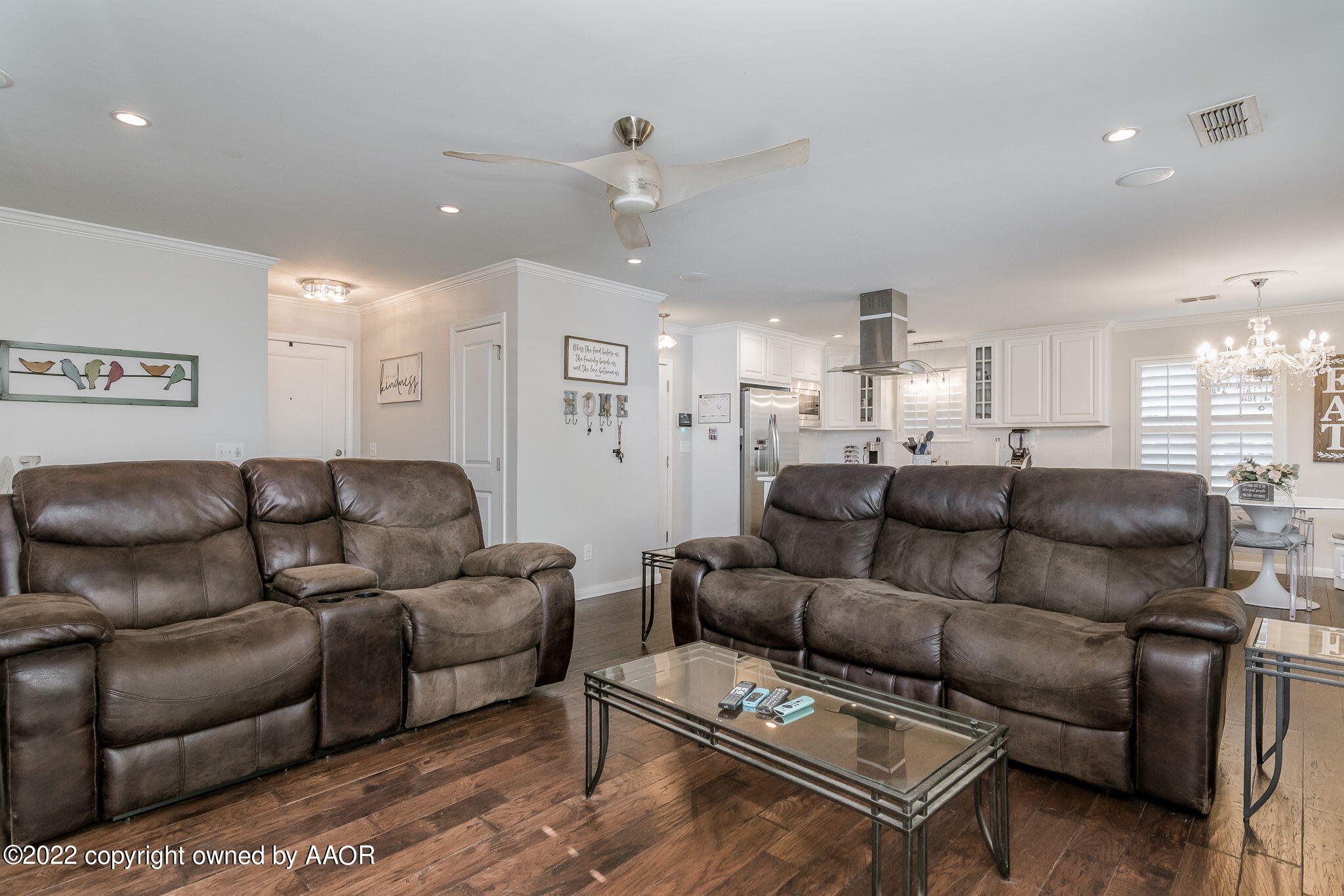 8101 Leah Trail Amarillo, TX 79110 - Photo 5 of 18 a living room with furniture and a chandelier