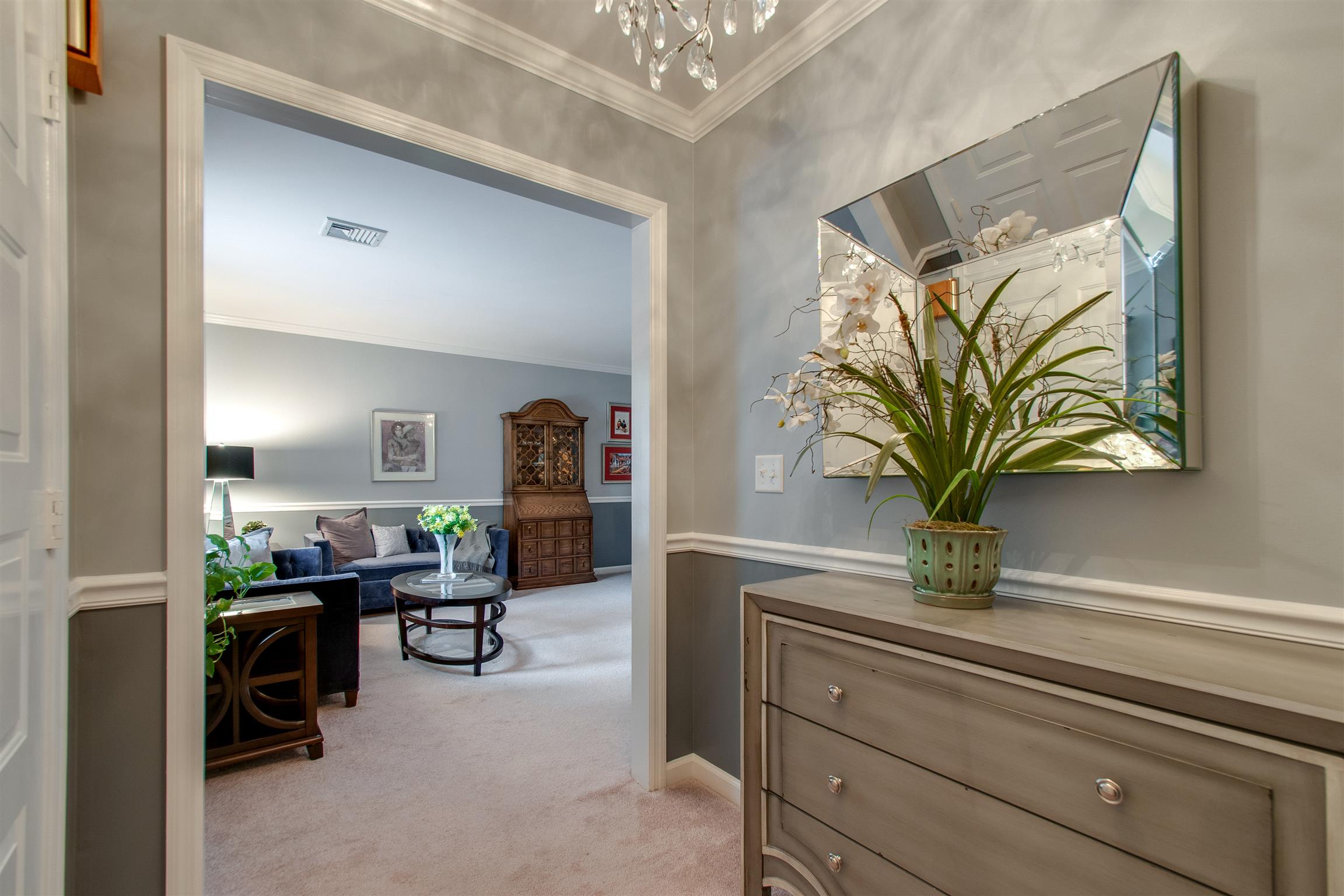 1018 General George Patton Road Nashville, TN 37221 - Photo 3 of 21 a living room with furniture and a potted plant