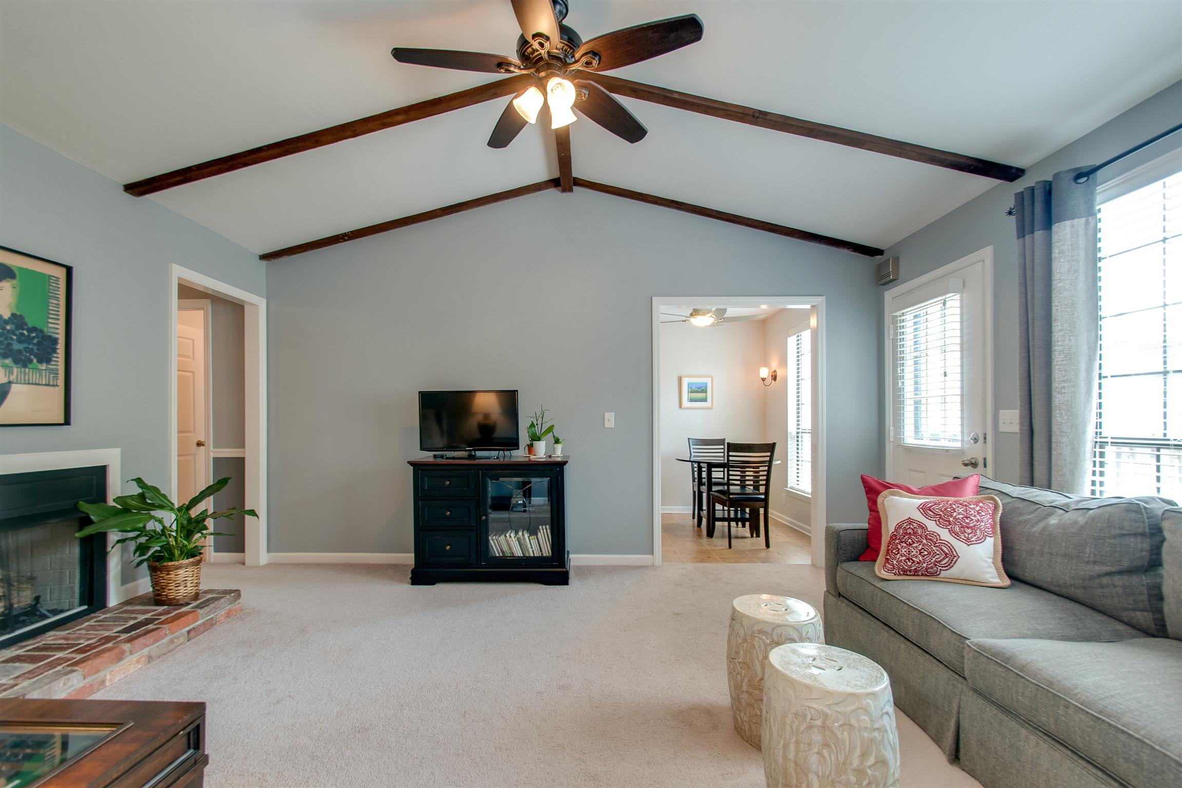 1018 General George Patton Road Nashville, TN 37221 - Photo 9 of 21 a living room with furniture and a flat screen tv