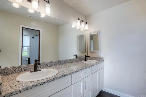 a bathroom with a toilet a sink and bathtub