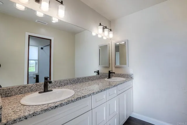 a bathroom with a toilet a sink and bathtub