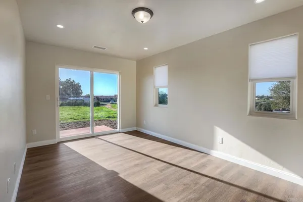 a bathroom with a glass shower door and a bathtub