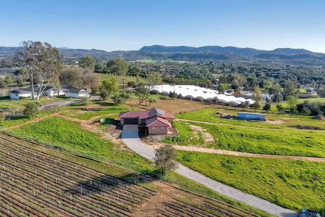 an aerial view of a golf course with a table