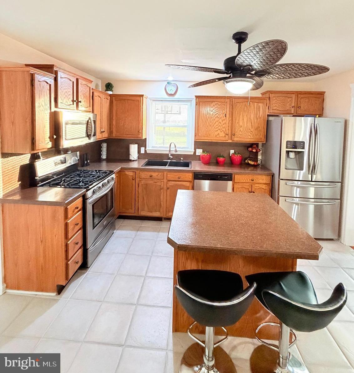 71 Apricot Avenue Leola, PA 17540 - Photo 4 of 30 a kitchen with stainless steel appliances granite countertop a stove a sink and a refrigerator