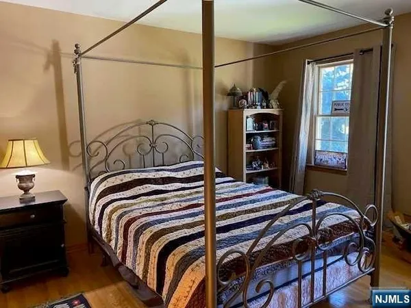 a bedroom with a bed and a closet