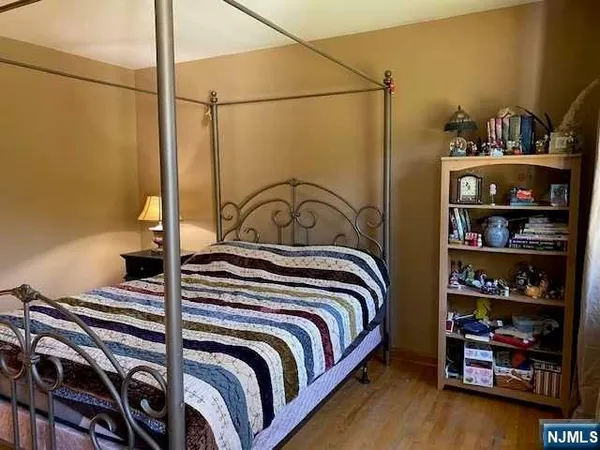 a bedroom with a bed and closet