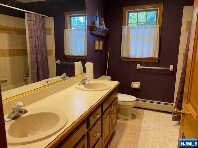 442 Elbert Street Ramsey, NJ 07446 - Photo 9 of 9 a bathroom with a sink toilet and shower