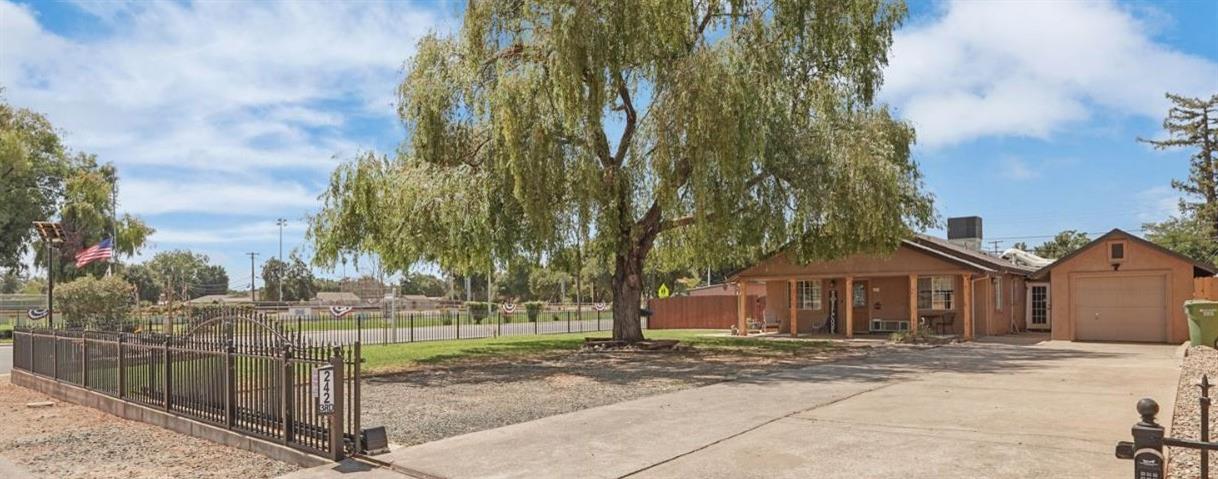242 3rd Street Galt, CA 95632 - Photo 1 of 31 a front view of a house with a yard