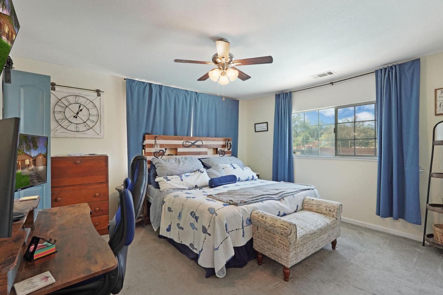 242 3rd Street Galt, CA 95632 - Photo 15 of 31 a bedroom with bed and wooden floor