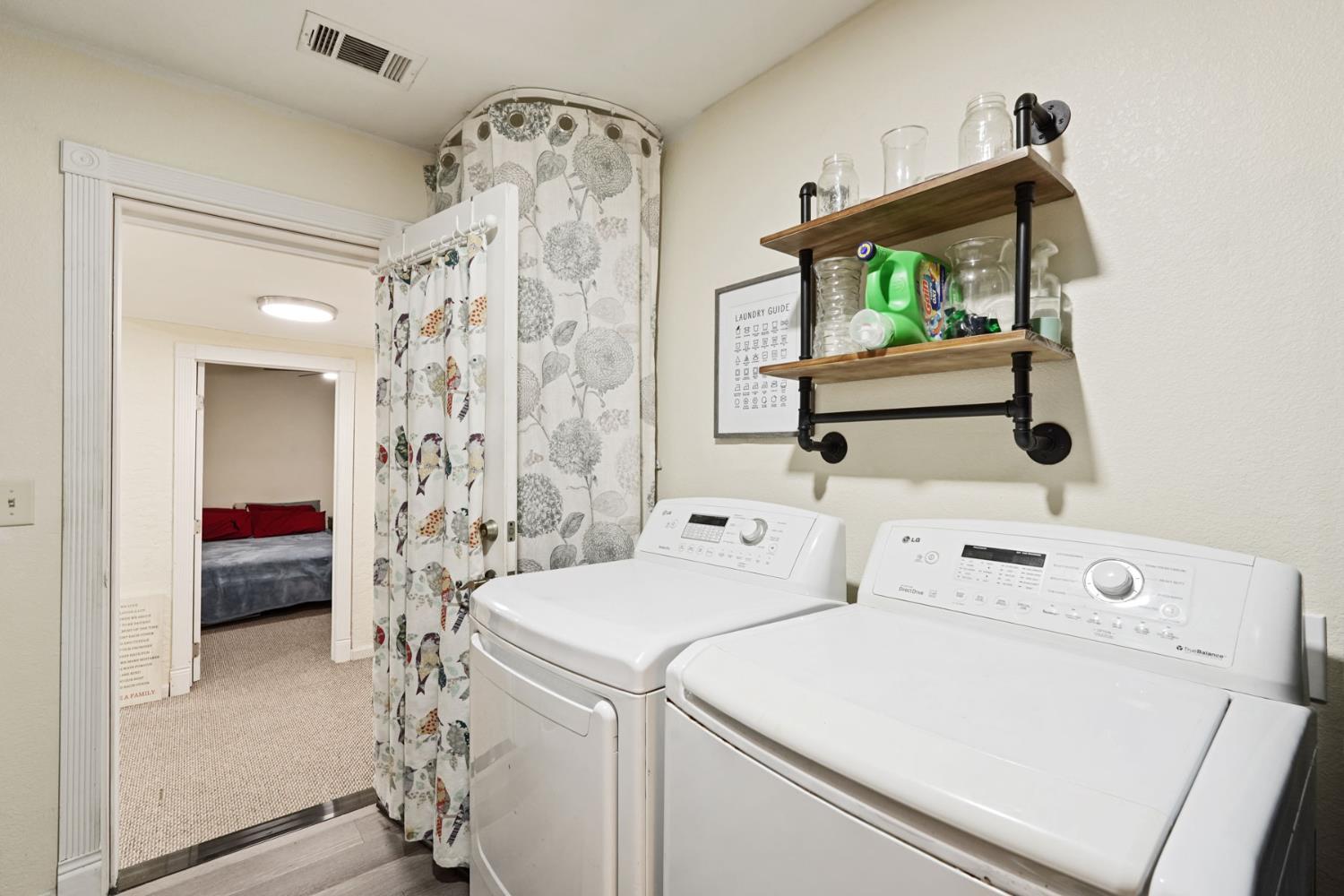 242 3rd Street Galt, CA 95632 - Photo 16 of 31 a view of washer and dryer with bathroom in the background