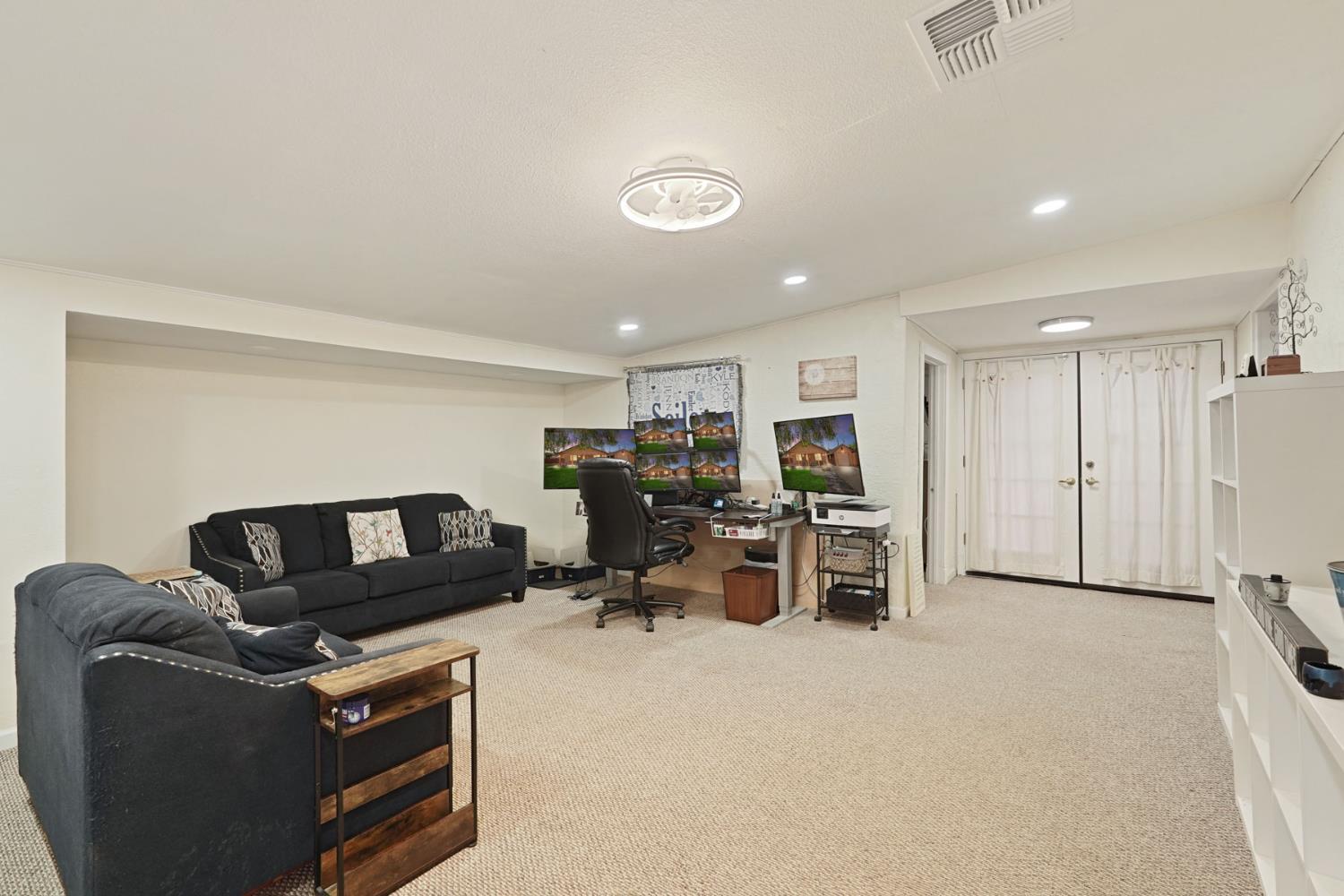 242 3rd Street Galt, CA 95632 - Photo 21 of 31 a living room with furniture and a flat screen tv