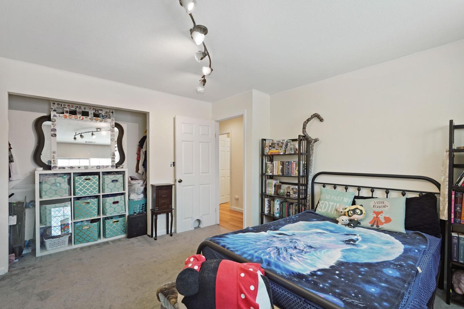 242 3rd Street Galt, CA 95632 - Photo 26 of 31 a bedroom with a bed and a table in it
