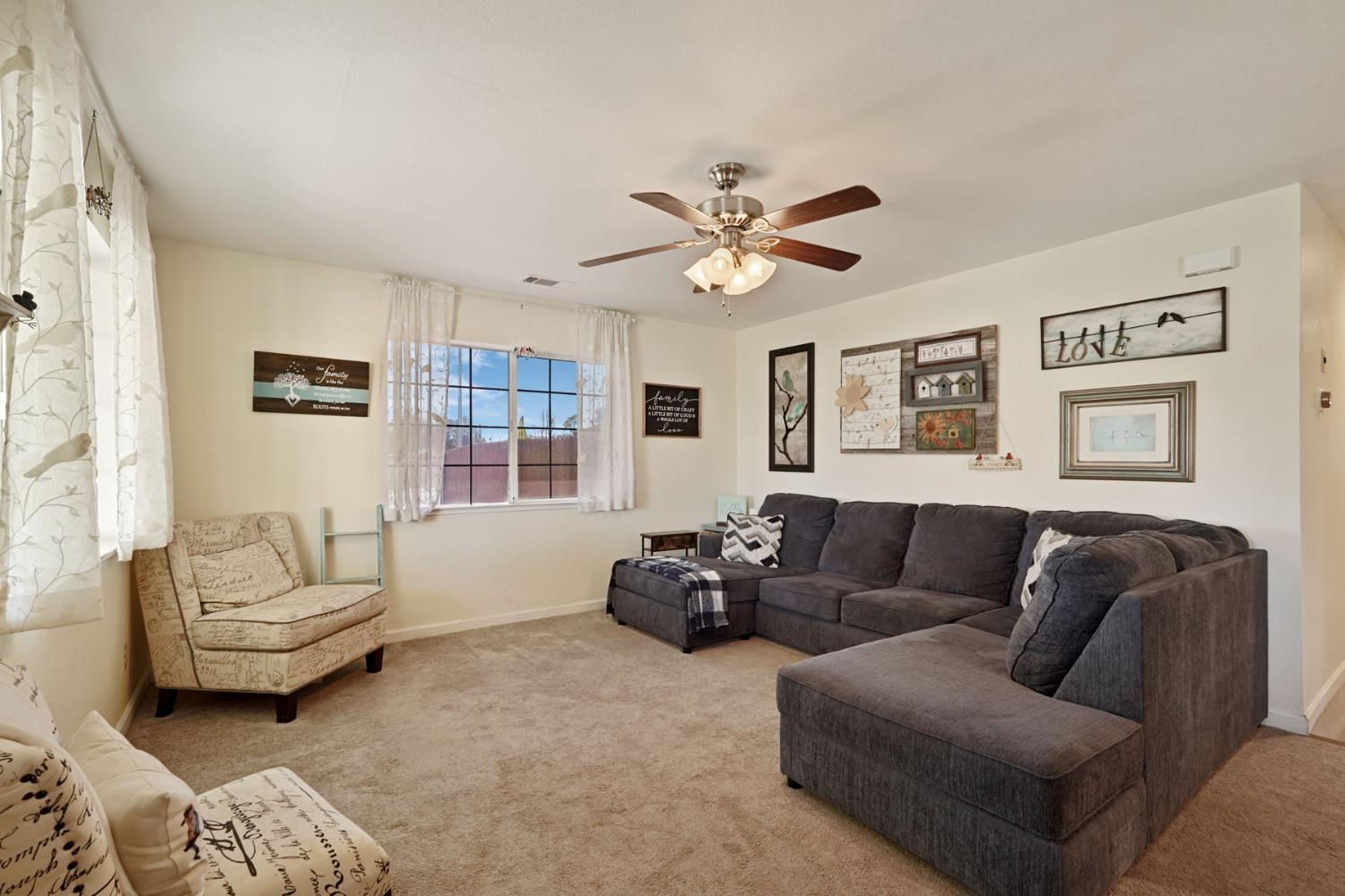 242 3rd Street Galt, CA 95632 - Photo 3 of 31 a living room with furniture and a large window