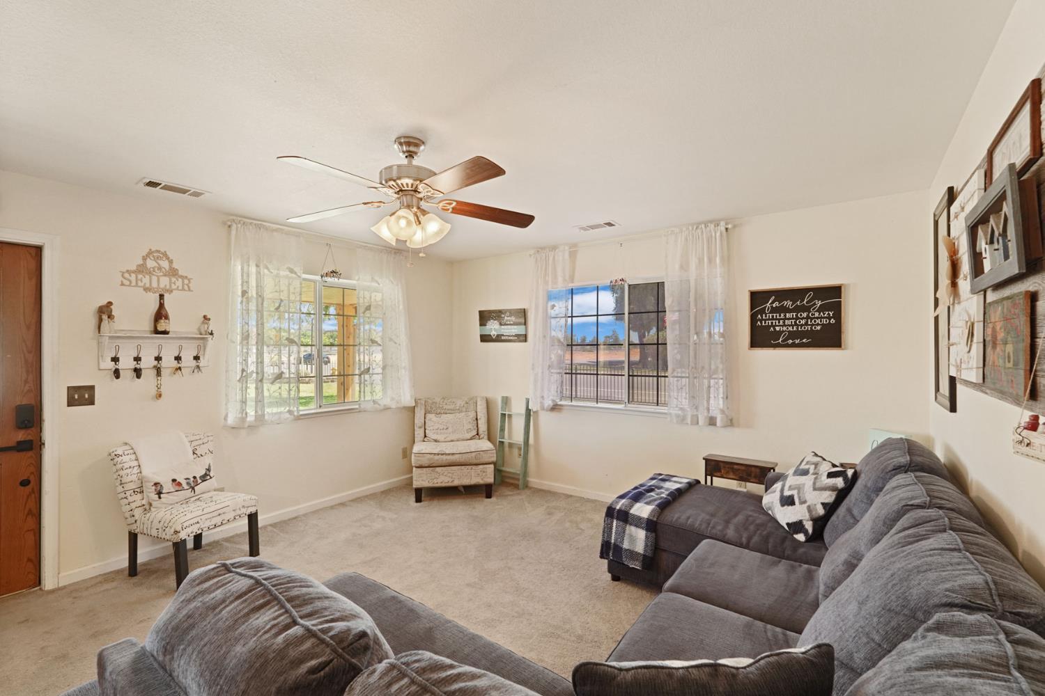 242 3rd Street Galt, CA 95632 - Photo 4 of 31 a living room with furniture and a large window