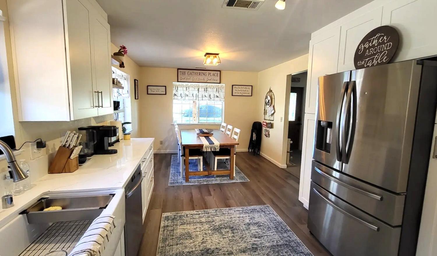 242 3rd Street Galt, CA 95632 - Photo 5 of 31 a kitchen with stainless steel appliances granite countertop a refrigerator stove and sink