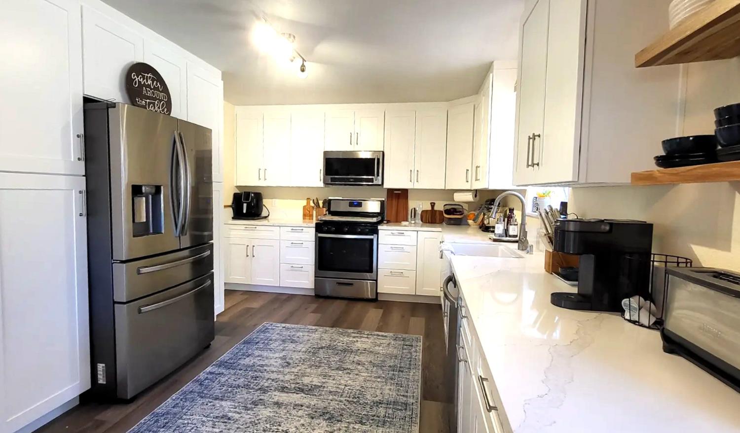 242 3rd Street Galt, CA 95632 - Photo 6 of 31 a kitchen with stainless steel appliances granite countertop a refrigerator stove and oven