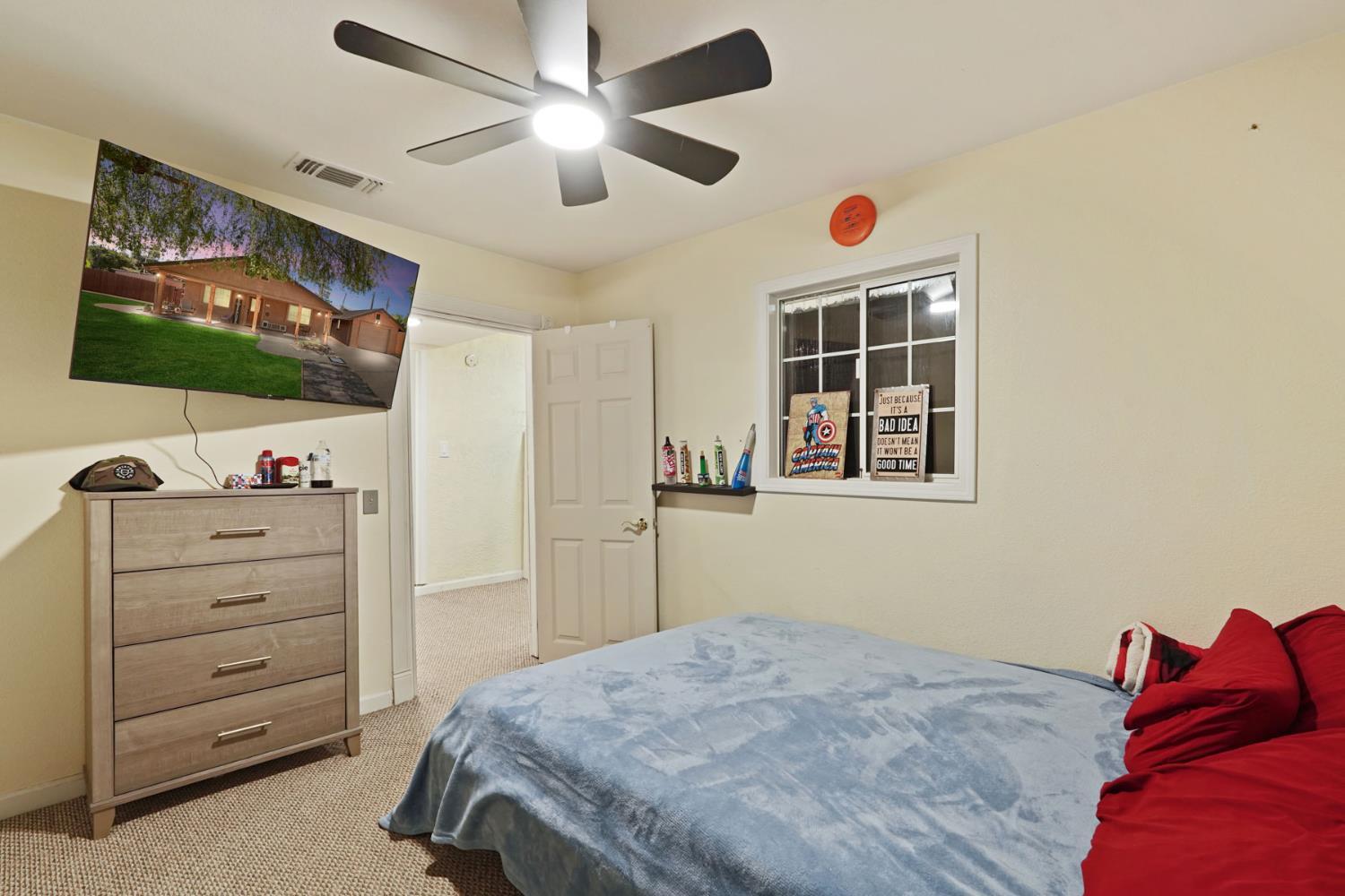 242 3rd Street Galt, CA 95632 - Photo 9 of 31 a bedroom with a bed and a flat screen tv