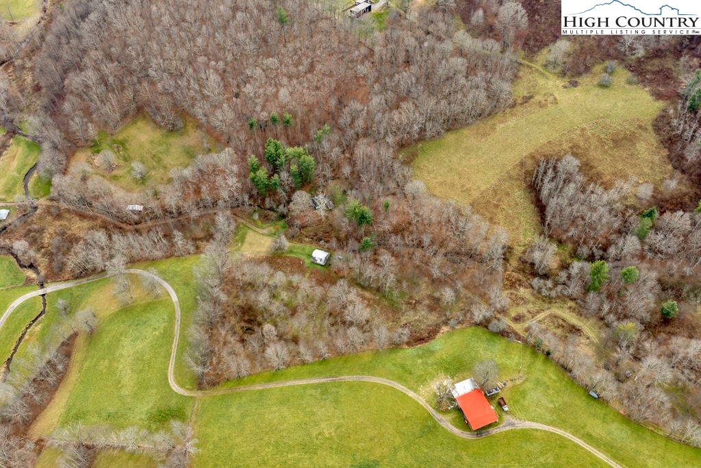9716 3 Top Road Todd, NC 28684 - Photo 19 of 23 a view of a swimming pool with a yard