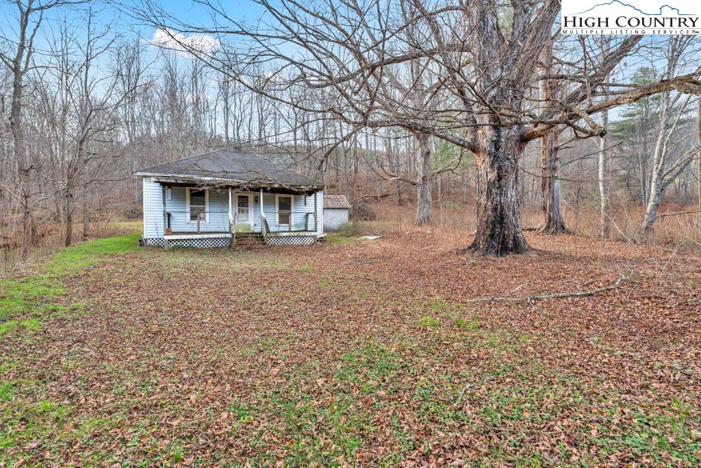 9716 3 Top Road Todd, NC 28684 - Photo 8 of 23 a front view of a house with a yard
