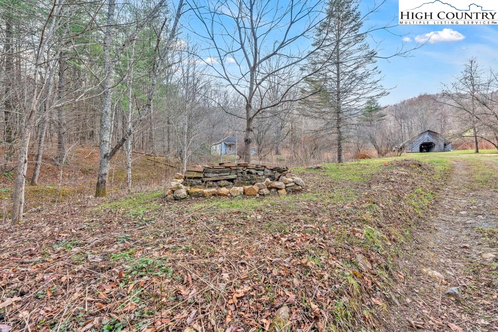 9716 3 Top Road Todd, NC 28684 - Photo 9 of 23 a view of a yard with snow on the road