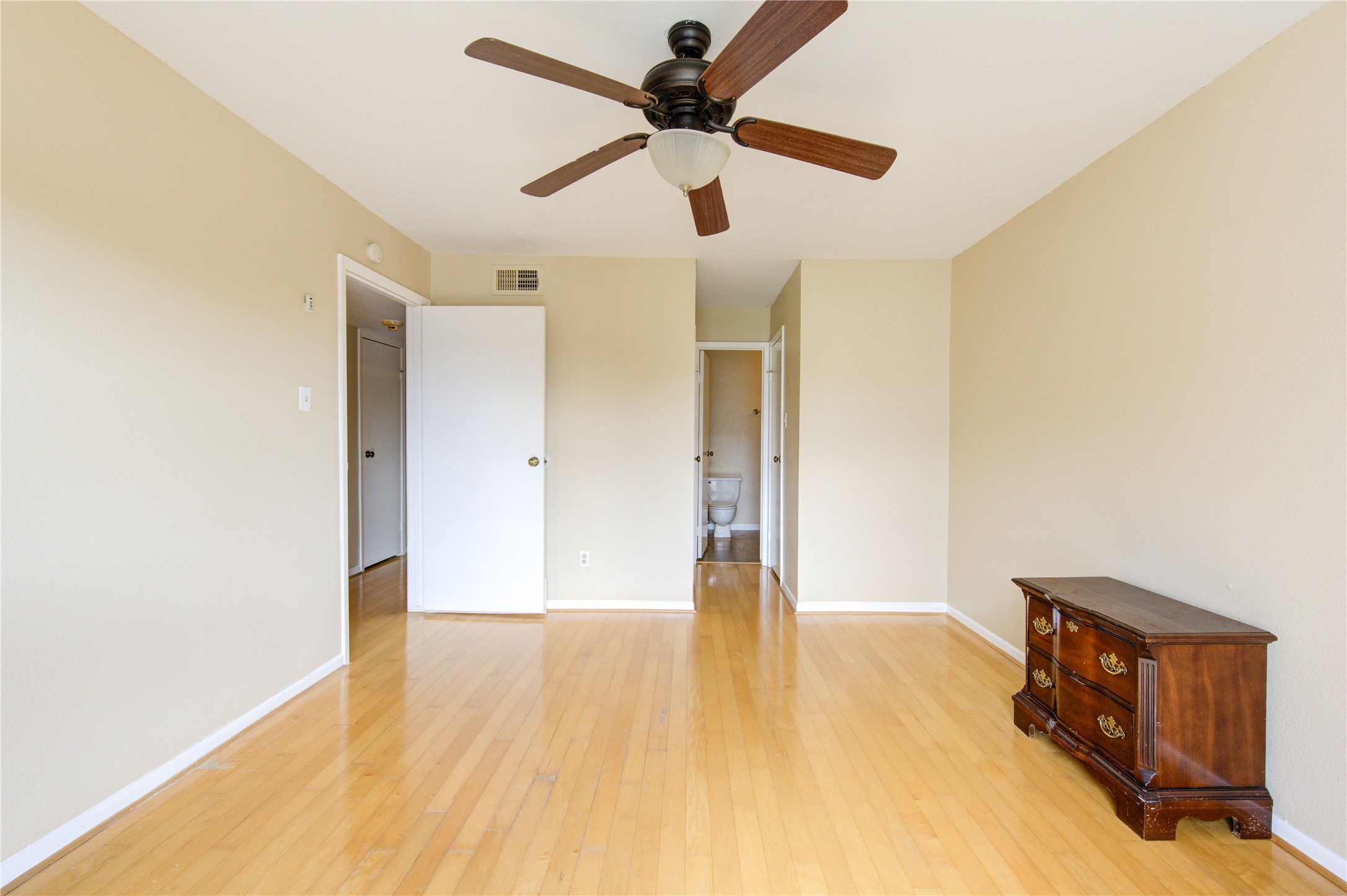 3055 Walnut Bend Lane, Unit 21 Houston, TX 77042 - Photo 16 of 31 a view of an empty room with wooden floor