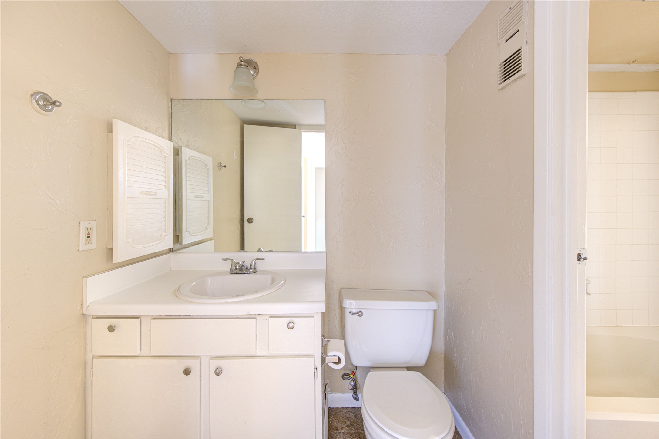 3055 Walnut Bend Lane, Unit 21 Houston, TX 77042 - Photo 24 of 31 a bathroom with a sink toilet and mirror